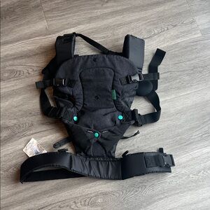 Infantino Convertible Carrier in
Charcoal and Teal .